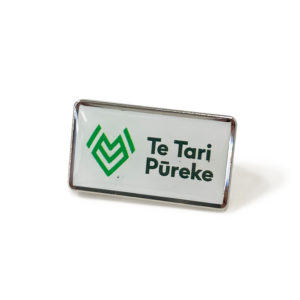 Te Tari Pureke Badge - 25mm, Bright Nickel Finish, Colour Print Resin Insert, Two Pin and Clutch